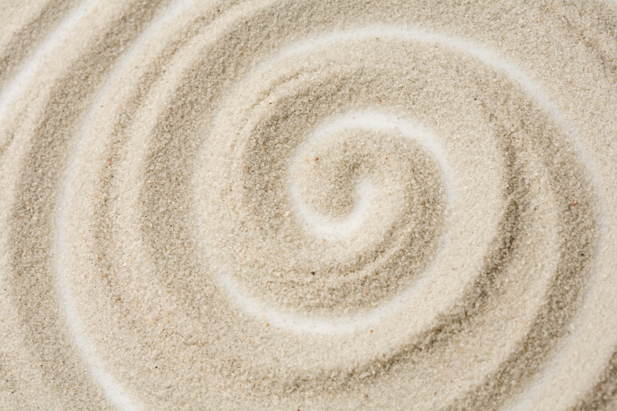 Photo of spiral pattern in the sand